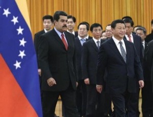 Venezuela's President Maduro walks with China's President Xi as they arrive for a welcome ceremony at the Great Hall of the People in Beijing